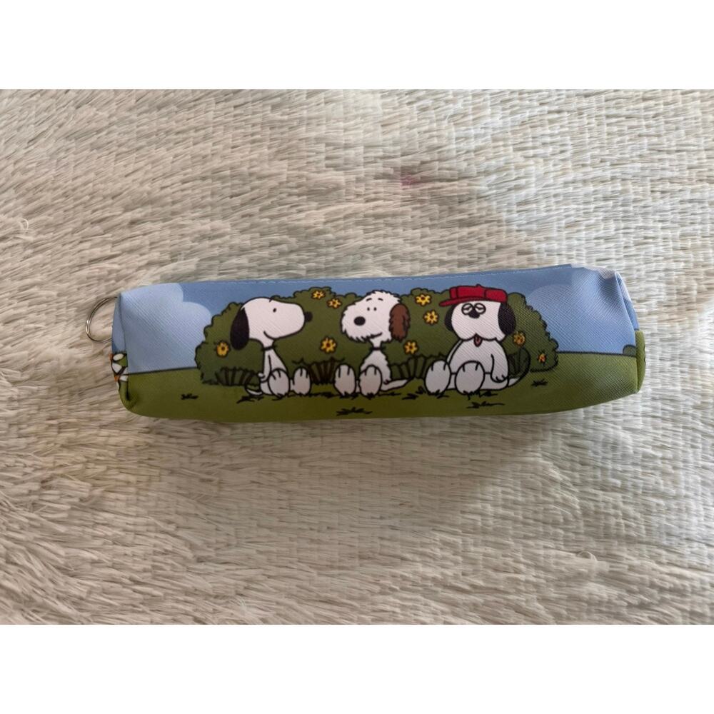 Snoopy and siblings pencil case zipper characters in a tree with flowers